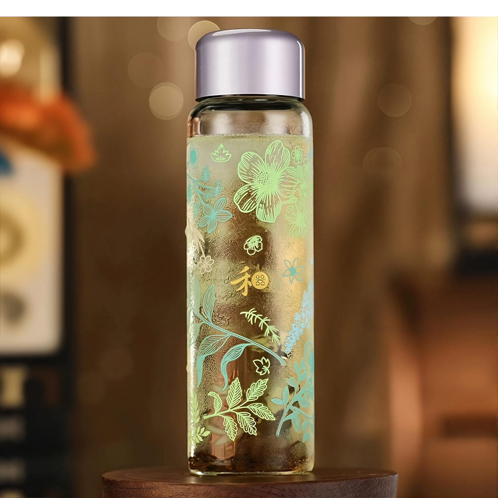 Decorative glass bottle with floral patterns on a wooden surface