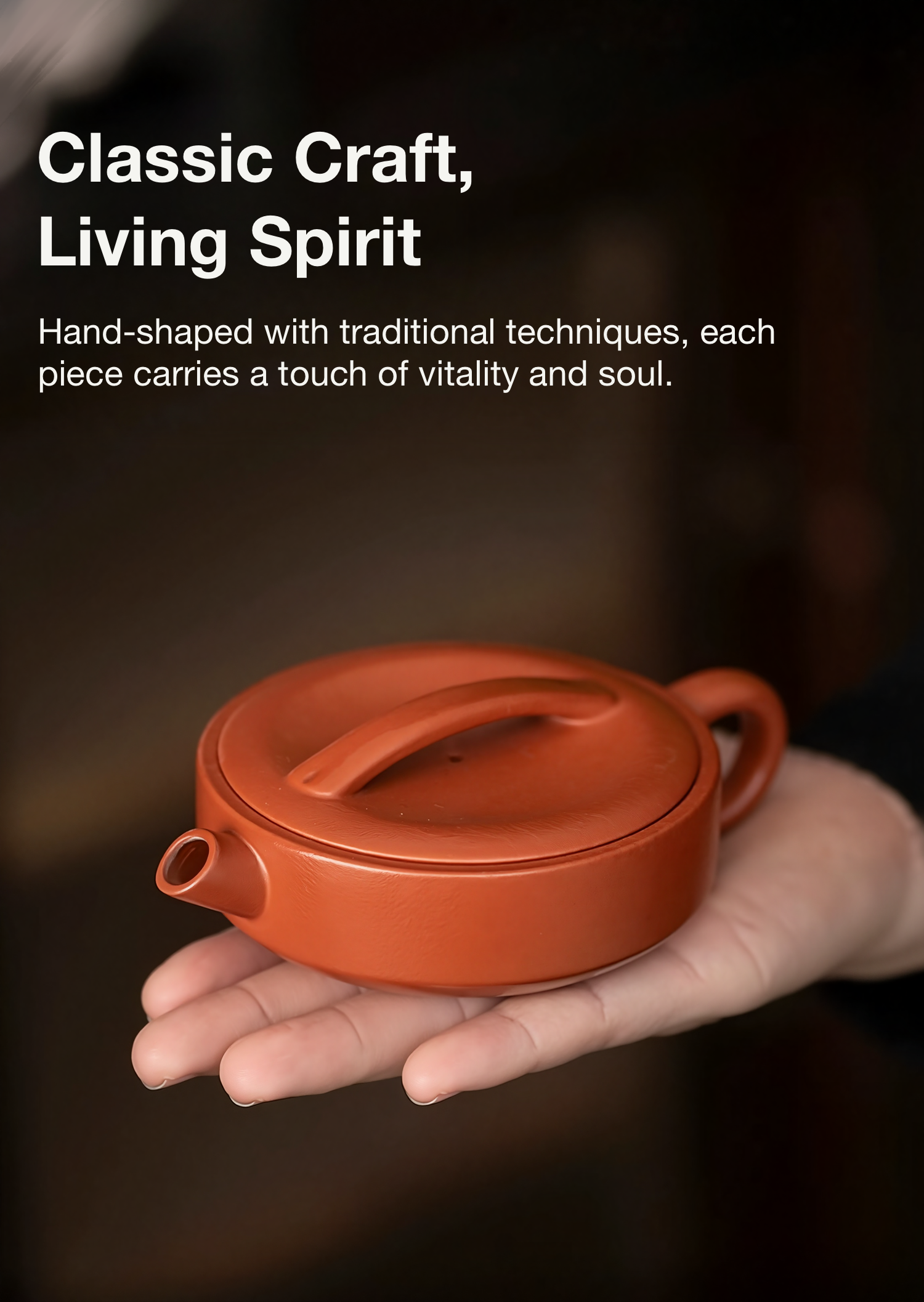 Hand-shaped terracotta teapot held in a hand with text about traditional techniques and vitality.