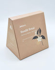 Sunlit Petal DanCong Oolong boxed set, featuring a citrus-forward floral blend in a premium triangular package.